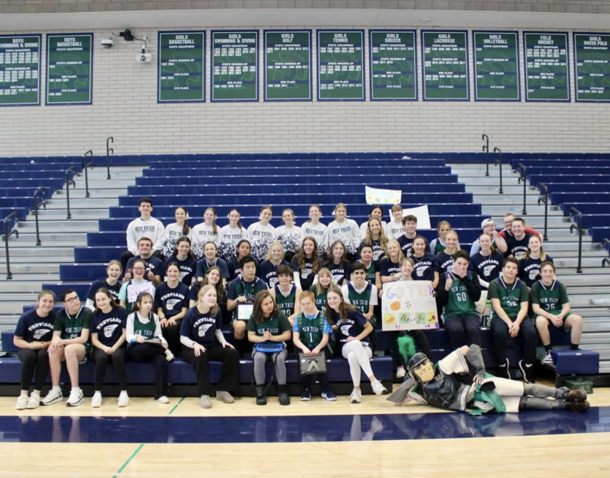 The program gets together for a photo after their basketball game vs Lake Forest High School on Feb. 6, 2025